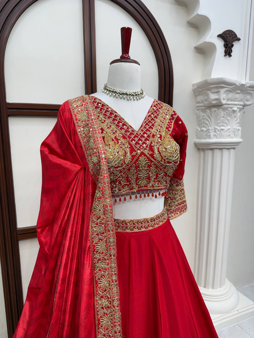 Regal Crimson Red Bridal Lehenga Choli Ensemble Featuring Intricate Gold Zari Embroidery, Heritage Motifs, and Embellished Tassels